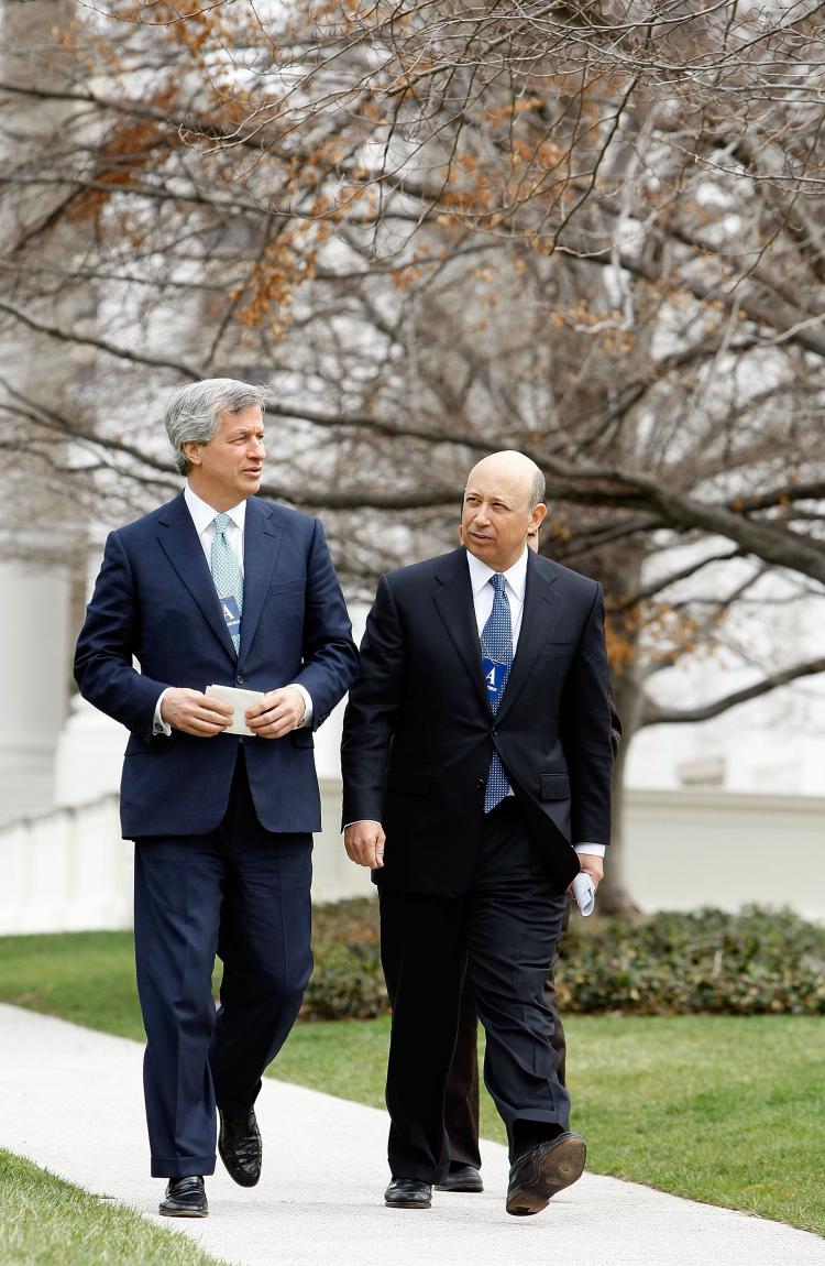 In this file photo, Goldman Sachs CEO Lloyd Blankfein (R) leaves the White House. Goldman Sachs said that profits surged 33 percent for the quarter. (Chip Somodevilla/Getty Images)