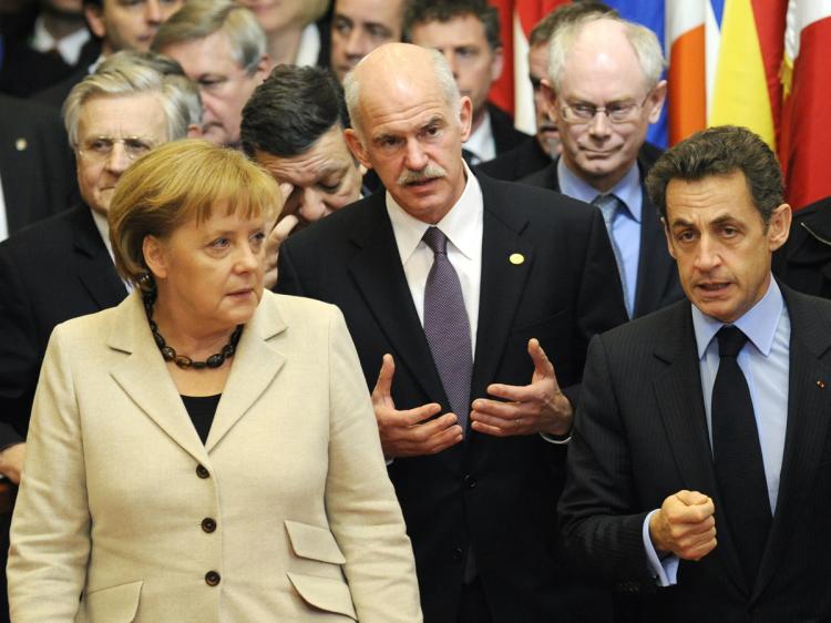 (L-R) German Chancellor Angela Merkel, Greek Prime Minister George A. Papandreou, and French President Nicolas Sarkozy leave for a European Union summit focussed on supporting debt-laden Greece and preventing contagion throughout the rest of the eurozone, on Feb. 11 in Brussels. (John Thys/AFP/Getty Images)