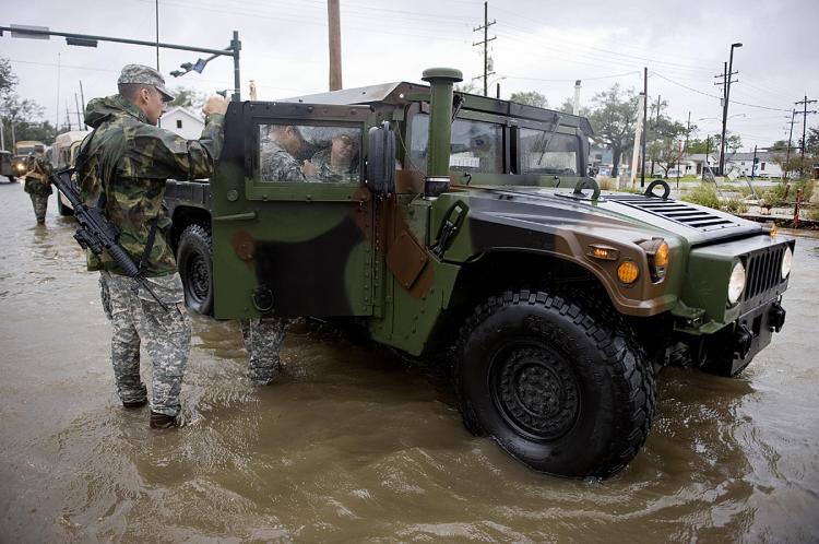 National Guard troops patrol a flooded neighborhood near the Industrial Canal in New Orleans, Louisiana, September 1, 2008 during Hurricane Gustav. (Jim Watson/AFP/Getty Images)