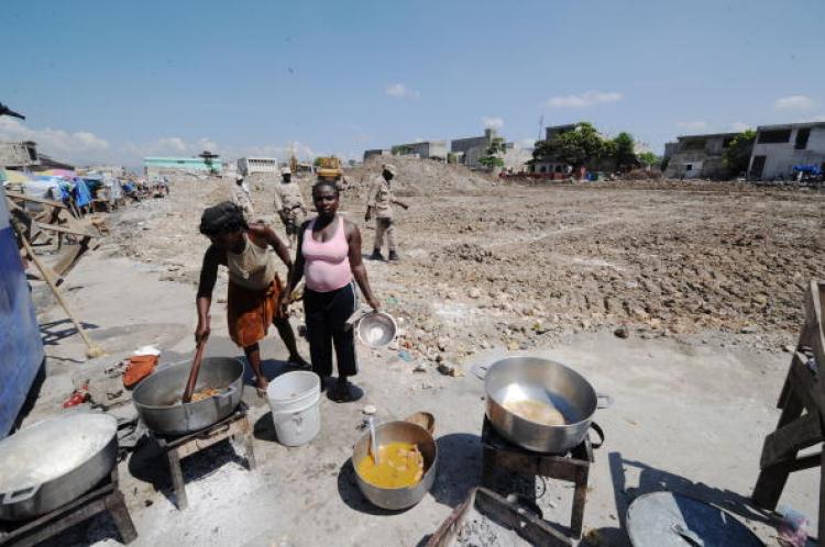 A Haitin woman sells food on October 14, 2010 amid the rubble of what was once a commercial strip in downtown Port-au-Prince. (Thony Belizaire/AFP/Getty Images)