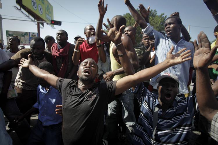 Protesters chant near police during an anti-United Nations demonstration, amid growing tensions with the UN security forces and the cholera epidemic on November 18, 2010 in Port-au-Prince, Haiti. (Lee Celano/Getty Images)