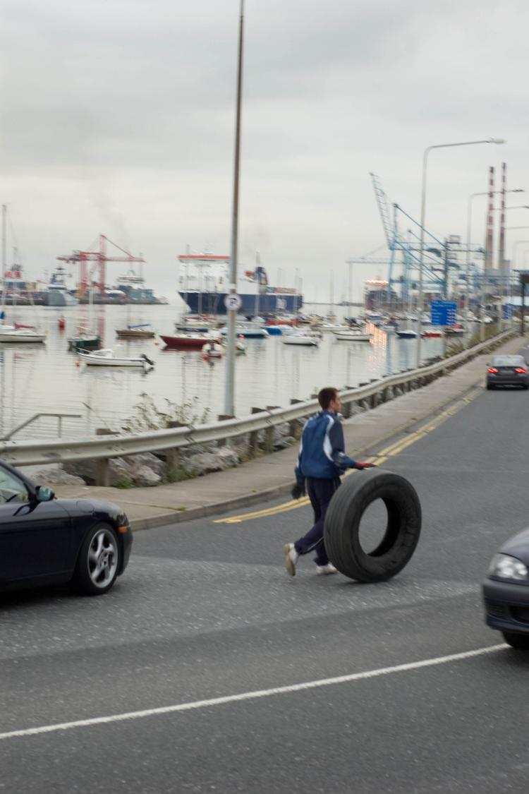Collection tyres for bomb fires (Martin Murphy/The Epoch Times)