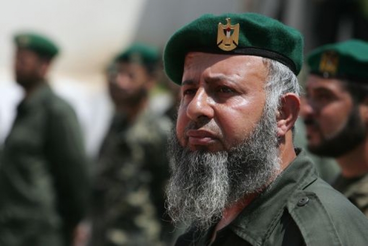 A Hamas security man looks on as his leader Ismail Haniya (unseen) reviews the honour guard during a visit to the Hamas security headquarters in Gaza City on July 7, 2008. (Mohammed Abed/AFP/Getty Images)
