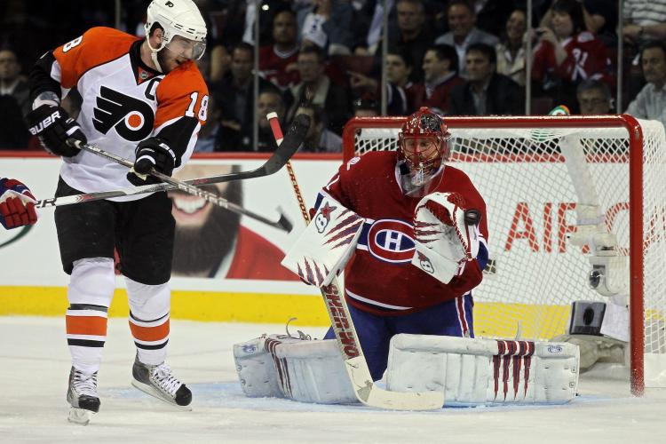 HALAK IS BACK: Montreal's goalie stopped 25 of 26 shots including this deflection from Mike Richards. (Jim McIsaac/Getty Images)