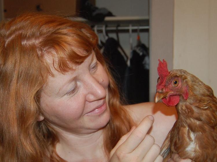 Mary March with one of her hens.  (Mary March)