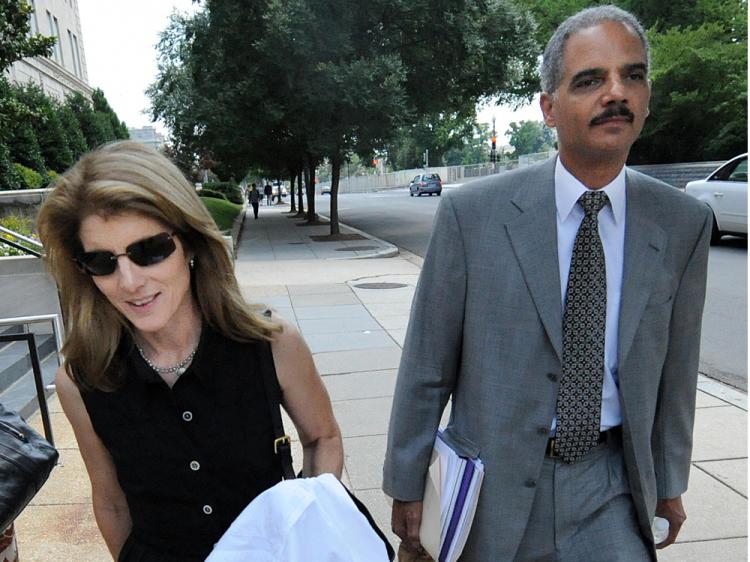Former deputy attorney general Eric Holder walks with Caroline Kennedy (L), daughter of late U.S. president John F. Kennedy, on Capitol Hill in Washington on June 25, 2008. (Tim Sloan/AFP/Getty Images)