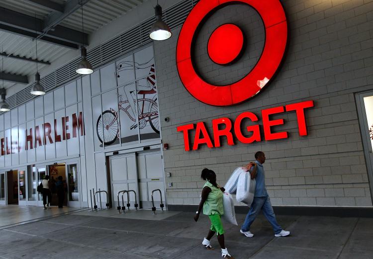 Customers walk outside Target's new Harlem store August 18, 2010 in New York City. (Chris Hondros/Getty Images)