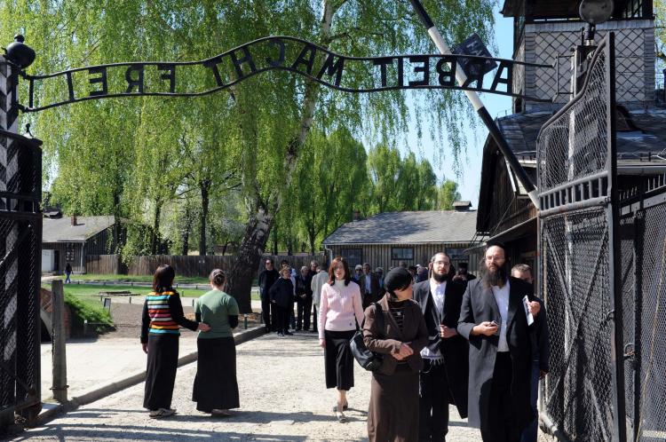 Jewish people gather at Auschwitz-Birkenau on the eve of Yom Hashoa Day on April 20, 2009 in Krakow, Poland. (Moshe Milner/GPO via Getty Images)