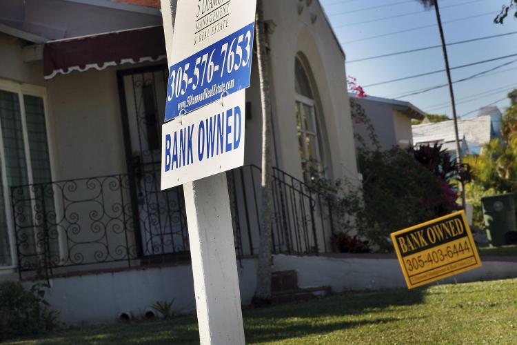 Home foreclosures: A bank owned sign is seen in front of a foreclosed home on December 7, 2010 in Miami, Florida.  (Joe Raedle/Getty Images)