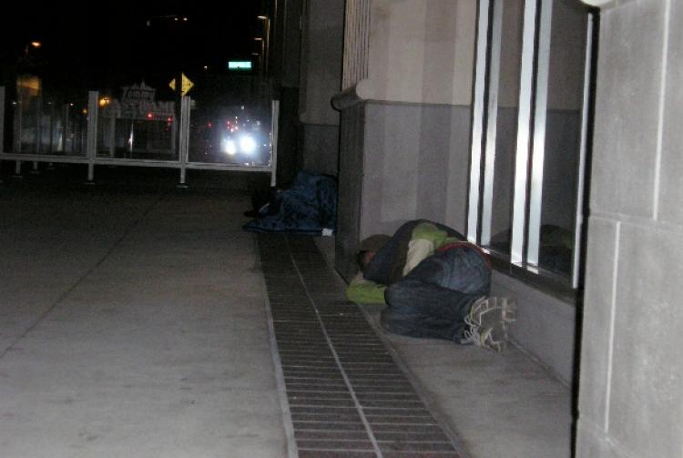 Two homeless men are sleeping on the street in downtown San Diego Nov. 12.   (Gisela Sommer/The Epoch Times)