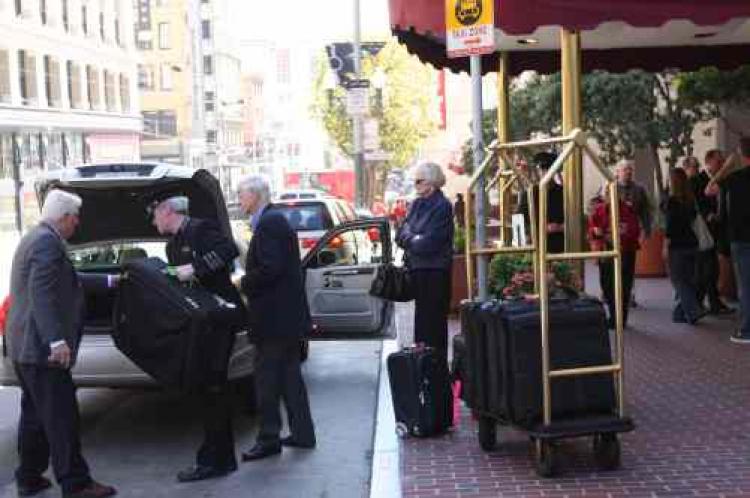 Bellmen assisting arriving hotel guests at the Grand Hyatt San Francisco. If negotiation with biggest hotel chains don't produce results, hotel workers may go on strike sometime in the next few weeks. (Ivailo Anguelov/Epoch Times Staff)