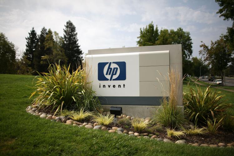 The HP logo is displayed on the entrance to the Hewlett-Packard Headquarters in Palo Alto, California.  (Justin Sullivan/Getty Images)