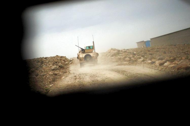 A U.S. Army Humvee moves on in Nuristan Province, Afghanistan. Soldiers can experience traumatic brain injury with no physical signs. (Spencer Platt/Getty Images)