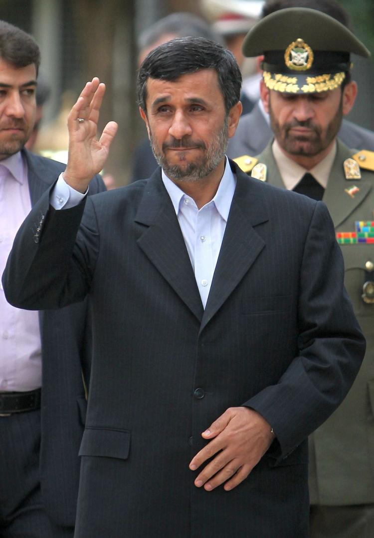 Iranian President Mahmoud Ahmadinejad waves as he waits for the arrival of his Tajik counterpart Emomali Rakhmon in Tehran on March 26. Ahmadinejad on Saturday rejected U.S. offer diplomacy and said that an increase in sanctions on oil import to his country would only serve to increase Iranians resolve and strength. (Behrouz Mehri/AFP/Getty Images)