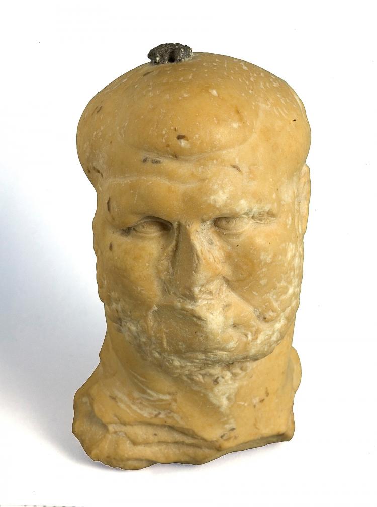 An 1,800 Year old marble figurine in the image of a bearded man, probably that of a Roman boxer, was discovered. (Clara Amit, Israel Antiquities Authority)