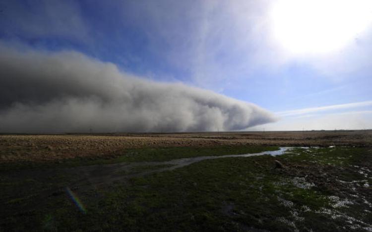 Smoke and ash from the Eyjafjallajokull volcano make their way across a field on April 19, 2010 near Nupur, Iceland. (Emmanuel Dunand/AFP/Getty Images)