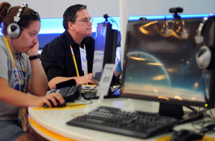 Accredited members of the media go online at the main press center for the Beijing 2008 Olympic Games. Foreign reporters will not have complete access to the Internet during the Beijing Olympics, Games organisers said on July 30, reversing a pledge to bri (FREDERIC J. BROWN/AFP/Getty Images )