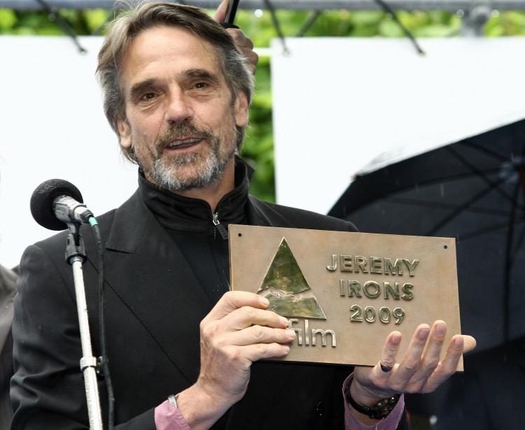 British actor Jeremy Irons poses with his commemorative plaque on the Bridge of Glory during the 17th Artfilm International Film Festival in Trencian. (STR/AFP/Getty Images)