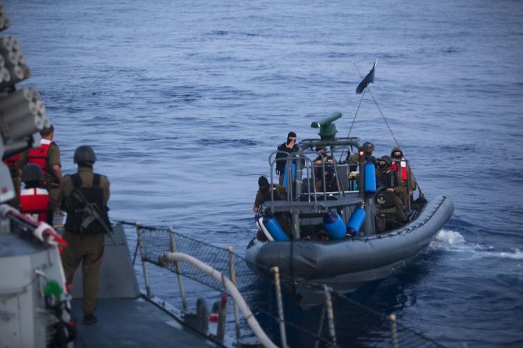 ISRAEL: Israeli Navy soldiers get ready to board a ship as the Israeli Navy intercepts peace boats bound for the Gaza Strip on May 31, in the Mediterranean sea. More than 10 people were killed after Israeli commandos boarded Gaza Flotilla ships. (Uriel Sinai-Pool/Getty Images)