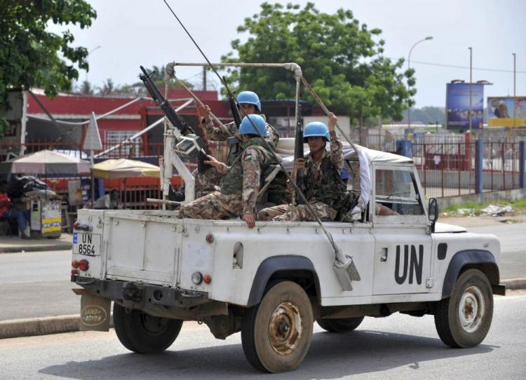 Jordanian soldiers members of the ONUCI patrol on a street of Abidjan on December 25, 2010. Ivory Coast marked a fearful Christmas today after West African leaders threatened military action to force defiant strongman Laurent Gbagbo to cede power to his rival Alassane Ouattara. (Sia Kambou/AFP/Getty Images)