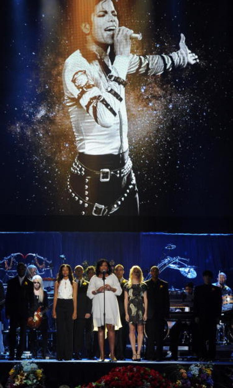 Artists perform during the memorial service for music legend Michael Jackson at the Staples Center in Los Angeles, California on July 7, 2009. (Gabriel Bouys/AFP/Getty Images)