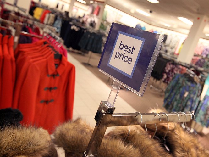 A sign reflecting J.C. Penney's new pricing stategy is seen at a store in the North Riverside Park Mall earlier this year in North Riverside, Ill.