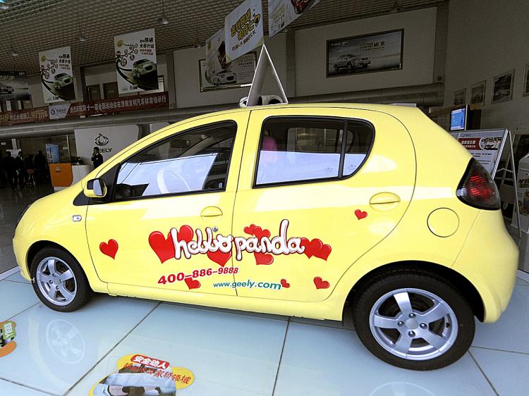 A Chinese Geely car sits on the showroom floor at its outlet in Beijing. (Liu Jin/AFP/Getty Images)