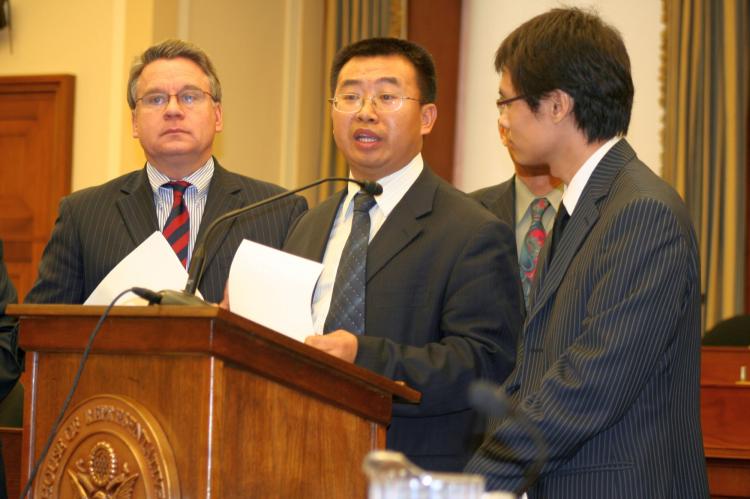 Jiang Tianyong appears at the Tom Lantos Human Rights Commission hearing last week, Nov. 10, on Capitol Hill regarding China's one-child policy. Standing to the left is Congressman Chris Smith from New Jersey. (Gary Feuerberg/The Epoch Times)