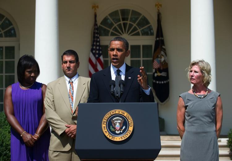 President Obama speaks about unemployment benefits and the economy alongside unemployed Americans Leslie Macko (R) of Charlottesville, Virginia, Denise Gibson (L) of Brooklyn, New York, and Jim Chukalas (2nd L) of Fredon Township, New Jersey, on July 19, in Washington, D.C. (Saul Loeb/Getty Images)