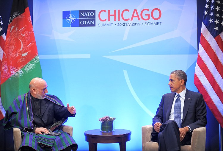 Afghan President Hamid Karzai speaks while meeting with U.S. President Barack Obama