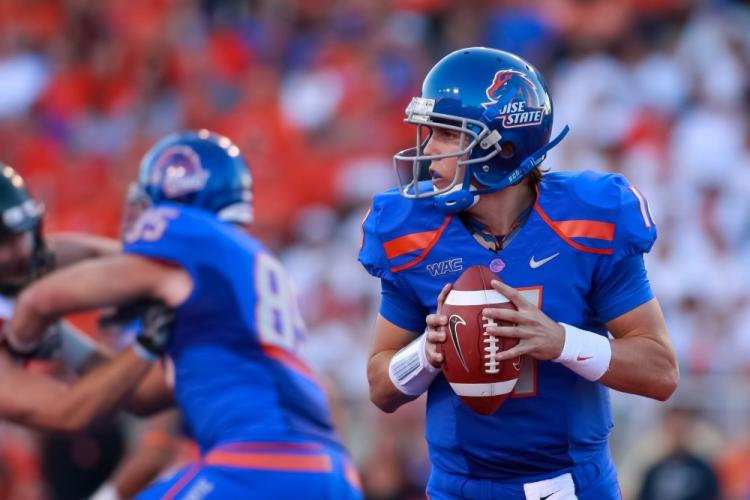 Kellen Moore #11 of the Boise State Broncos looks for a receiver against the Oregon State Beaversat Bronco Stadium on September 25, 2010 in Boise, Idaho. (Otto Kitsinger III/Getty Images)