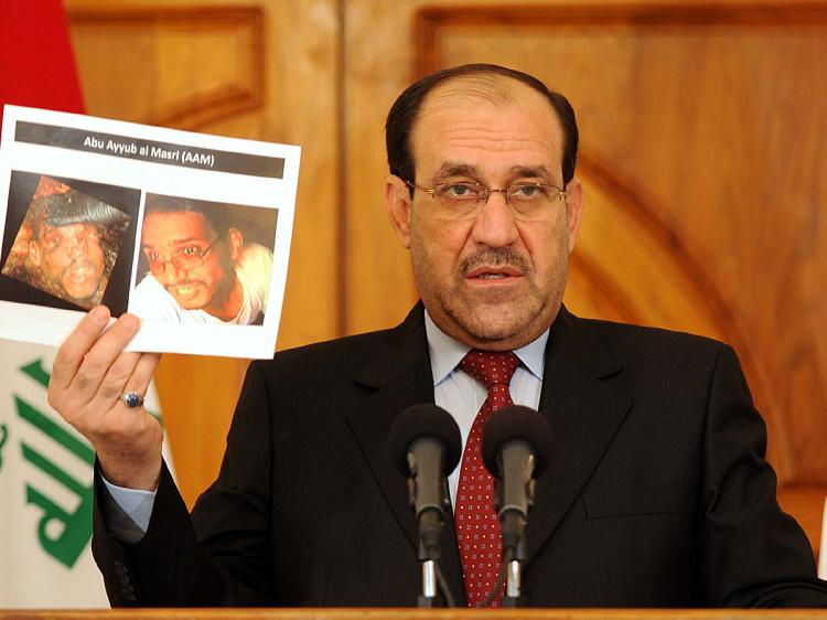 Iraq's Prime Minister Nouri al-Maliki holding photographs of a man identified as al-Qaida leader in Iraq Abu Ayyub al-Masri at a news conference on April 19, 2010 in Baghdad, Iraq. (Iraqi Prime Minister office via Getty Images)