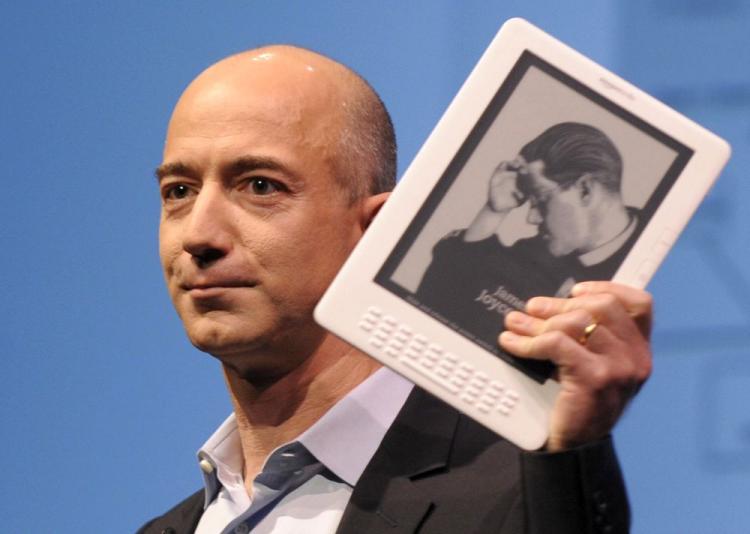 Online retail giant Amazon.com CEO Jeff Bezos with the Kindle DX. (Emmanuel Dunand/AFP/Getty Images)