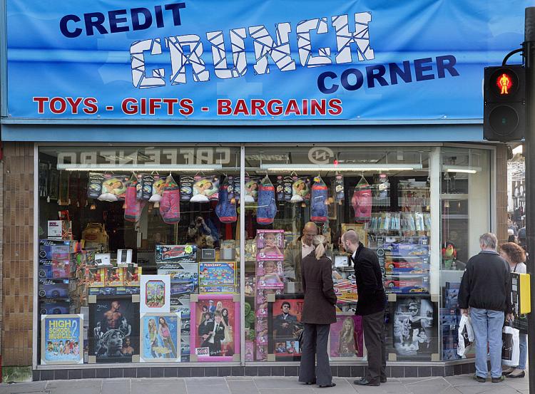 Shoppers gather around a shop called the Credit Crunch Corner in Salisbury, England.   (Matt Cardy/Getty Images)