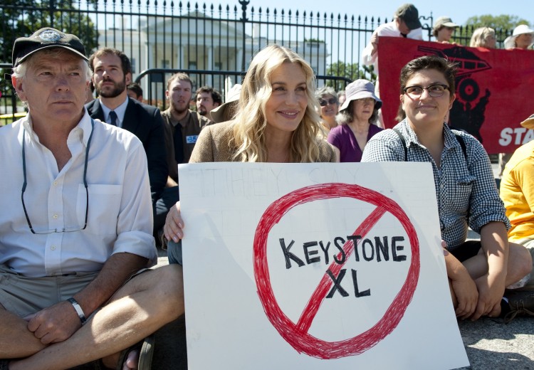 American actress Daryl Hannah (C) sits in front of the White House in Washington, D.C., on Aug. 30 during a protest against the construction of the Keystone XL pipeline. Hannah was among dozens of protesters arrested in a demonstration against the oil pipeline which, if constructed, would run from Alberta's oil to Texas. (Saul Loeb/AFP/Getty Images) American actress Daryl Hannah (C) sits in front of the White House in Washington, D.C., on Aug. 30 during a protest against the construction of the Keystone XL pipeline. Hannah was among dozens of protesters arrested in a demonstration against the oil pipeline which, if constructed, would run from Alberta's oil to Texas. (Saul Loeb/AFP/Getty Images)