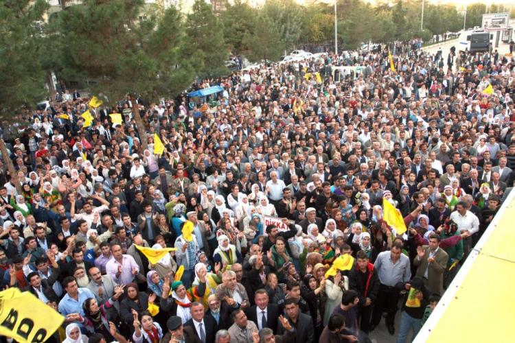 Turkish Kurds wait in front of a courthouse where more than 150 Kurds, including a dozen elected officials, went on trial in Diyarbakir on Oct. 18. The accused are on trial for ties with the Kurdistan Workers' Party (PKK), movement involved in armed conflicts with the central authority of Turkey. (STR/AFP/Getty Images)