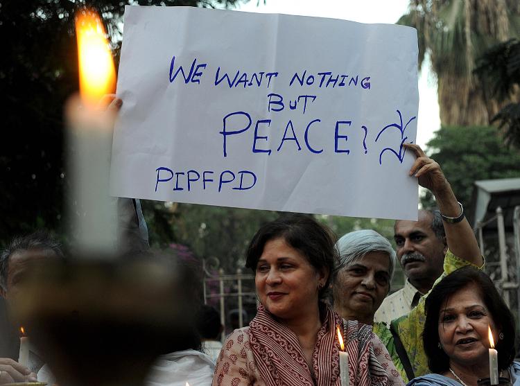 Activists from the Pakistan India Peoples Forum for Peace and Democracy hold candles for peace in Karachi on December 4, 2008.   (Asif Hassan/AFP/Getty Images)