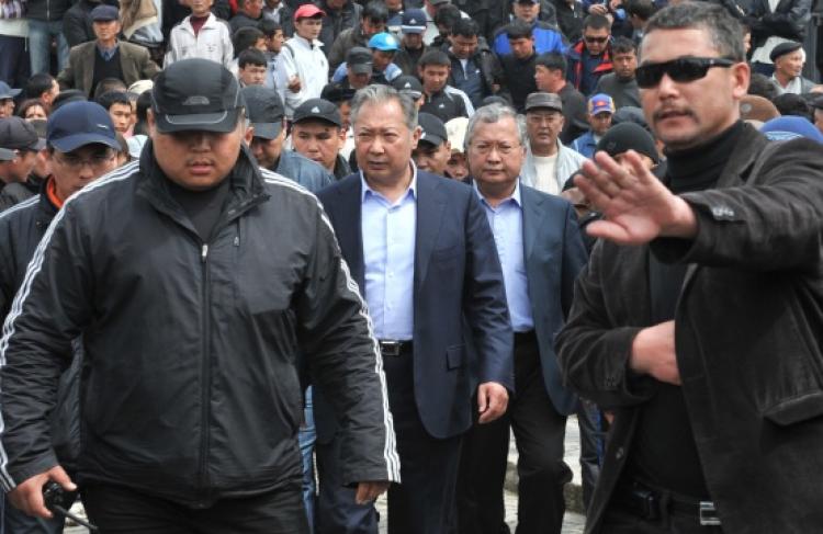 Ousted Kyrgyz President Kurmanbek Bakiyev (C), surrounded by his bodyguards, walks with his supporters during a rally in Jalal-Abad some 1,300 miles outside Bishkek on April 13. (Vyacheslav Oseledko/AFP/Getty Images )