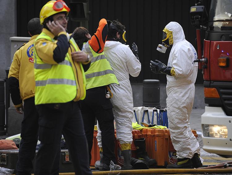 Spanish emergency services get ready to enter into the U.S. embassy in Madrid on December after a suspicious package was discovered inside.  (Pierre-Philippe Marcou/AFP/Getty Images)