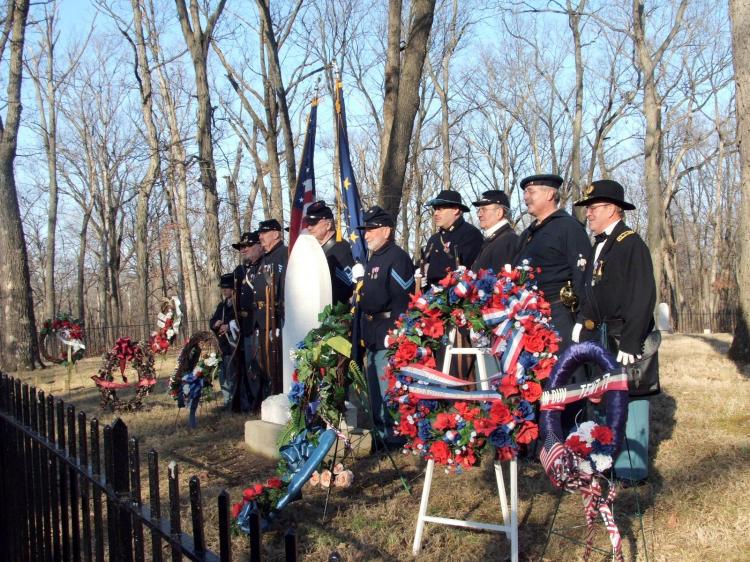 Nancy Lincoln's grave with wreaths to honor her on Abe's birthday in Civilwar attire in Lincoln city, Indiana. (The Epoch Times)