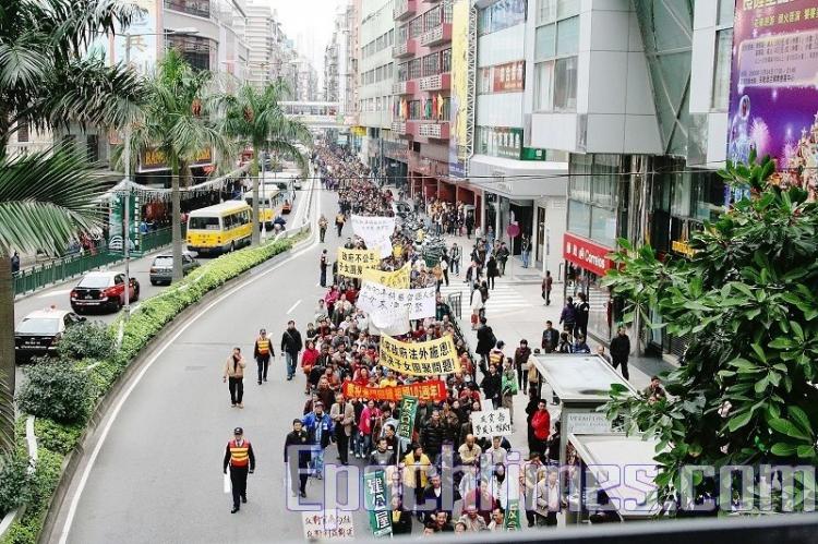 A mass rally and march is held in Macau on the 10th anniversary of Macau's return to Chinese rule.  (The Epoch Times)