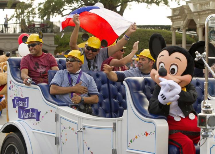 SALUTE TO CHILEAN MINERS AT MAGIC KINGDOM: In this handout photo provided by Disney, the rescued Chilean coal miners, wearing mouse-eared hard hats, pose for a photo on Main Street, U.S.A. at the Magic Kingdom on Jan, 31. All of the miners, their rescuers, and their families are enjoying a Disney-provided holiday. (Kent Phillips/Disney via Getty Images)