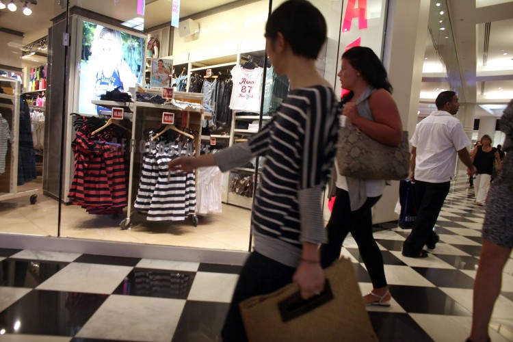 RISING PRICES: People walk through a mall last month in New York City. Fears of stagflation in the U.S. economy are on the rise. Stagflation happens when the economy has slow growth, unemployment has risen to record heights, and prices are rising, or the country is in an inflationary stage.   (Spencer Platt/Getty Images)