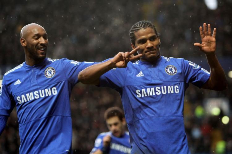 Chelsea's Florent Malouda indicates how many goals his team would score on Saturday. (Phil Cole/Getty Images)