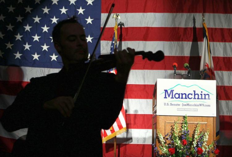 A violinist performs during the election night party of Democratic U.S. Senate candidate and West Virginia Governor Joe Manchin November 2, 2010 in Charleston, West Virginia. There has been reports that Manchin has won over Republican challenger John Raese. (Alex Wong/Getty Images)