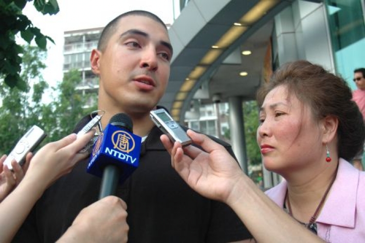 U.S. Marine John Caldwell talks to reporters in Flushing, New York City. Caldwells mother, Judy Chen, was attacked recently by mobs of angry Chinese incited by the Chinese Consulate. (Joshua Philipp/The Epoch Times)