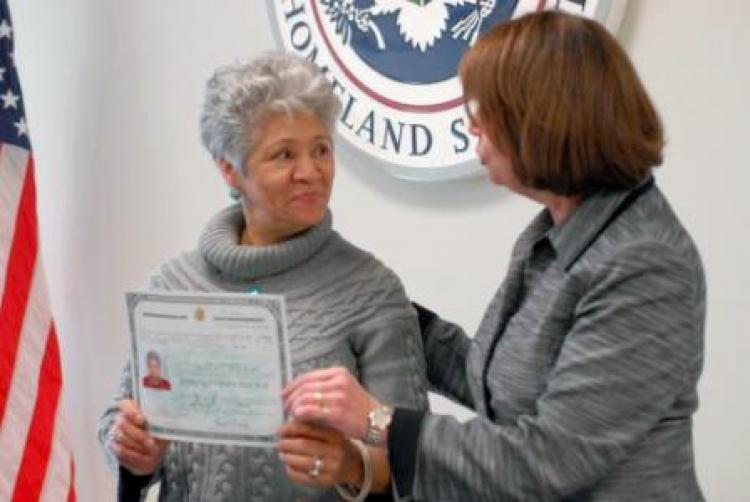 Jenis Martinez receives her new naturalization certificate from U.S. Citizenship and Immigration Services New York District Director Andrea Quarantillo. (Photos courtesy of USCIS)