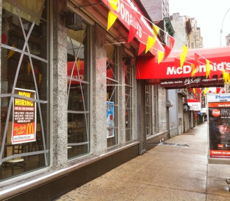 A McDonald's restaurant is closed the afternoon of Saturday, Aug. 27, with its windows taped ahead of Hurricane Irene. (Kristen Meriwether/The Epoch Times)