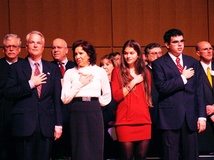 FAMILY: New York Congressman-elect Michael McMahon, New York Supreme court justice Judith McMahon, their daughter Julia and son Joseph at an the unofficial swearing-in ceremony on Staten Island Sunday.  (Peter Wei/The Epoch Times)