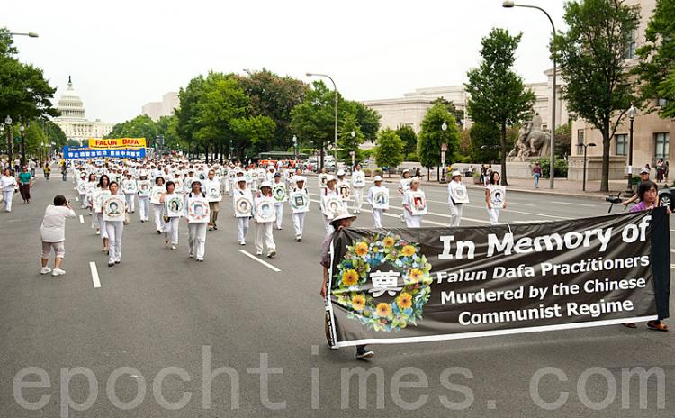 Thousands of Falun Gong practitioners march through Washington D.C. calling for an end to the persecution.